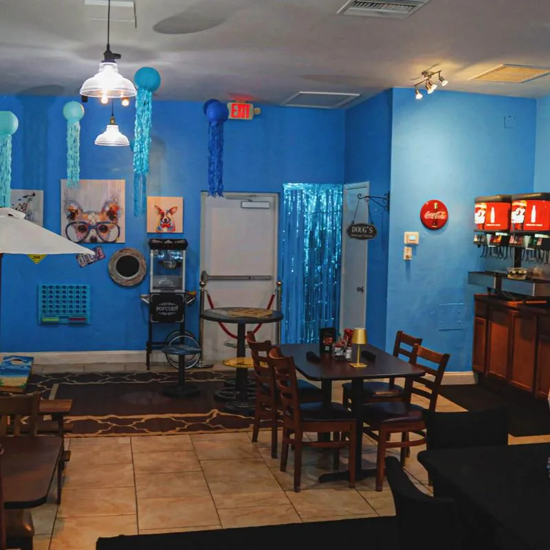 Nautical-themed dining room with hanging lanterns at Doug's Seafood