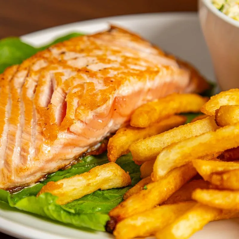 Grilled salmon with fries and coleslaw