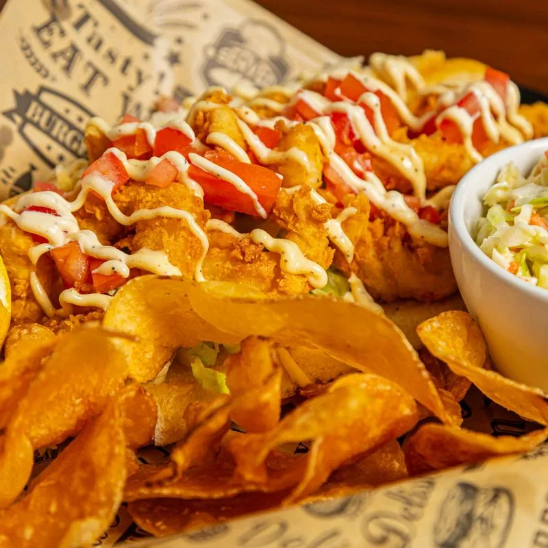 Shrimp po' boy with chips and coleslaw